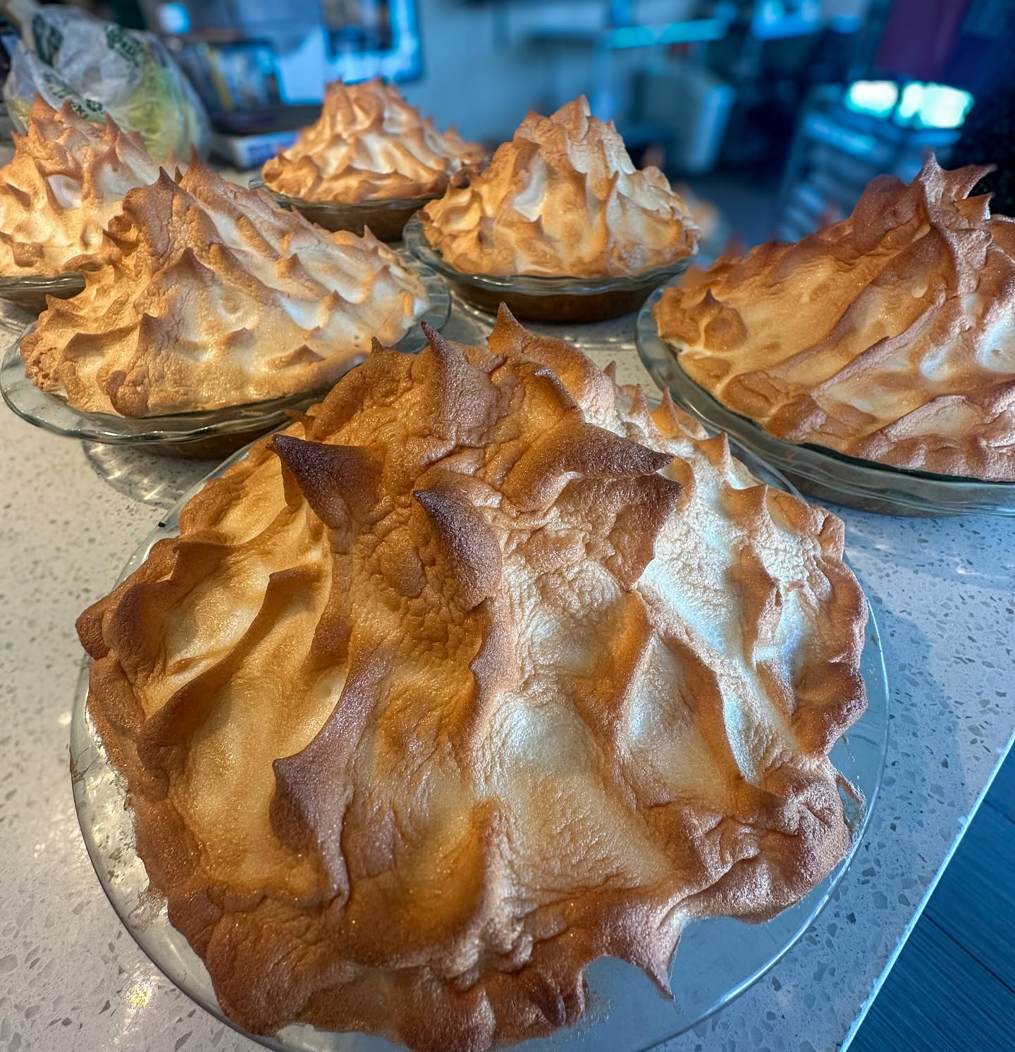 Tall meringue pies fresh from the oven, made in house