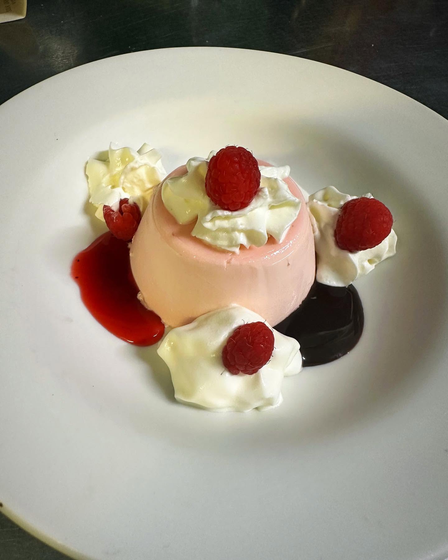 Panna cotta with raspberries and chocolate sauce