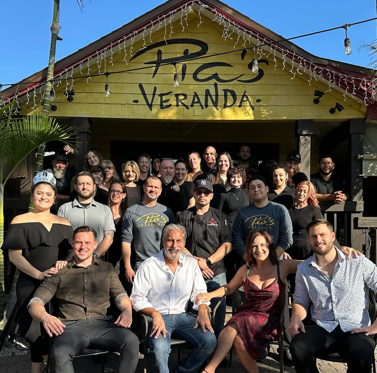 The Veranda crew gathered under the Pia's Veranda sign