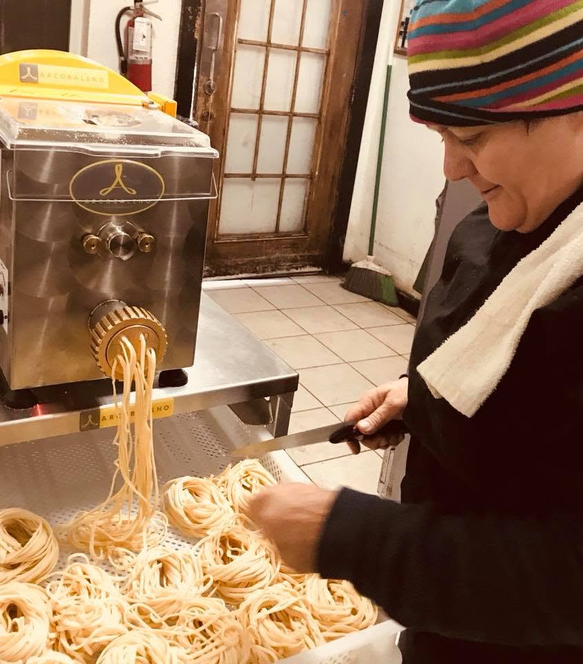 Fresh pasta coming out of the pasta machine in the Trattoria kitchen