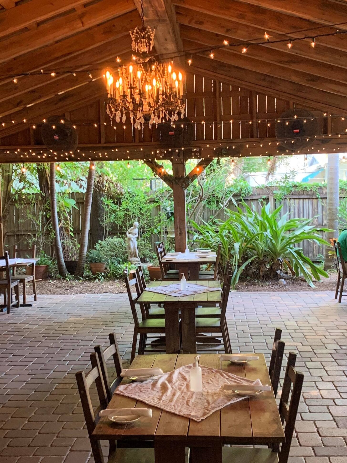 The covered patio under its chandelier