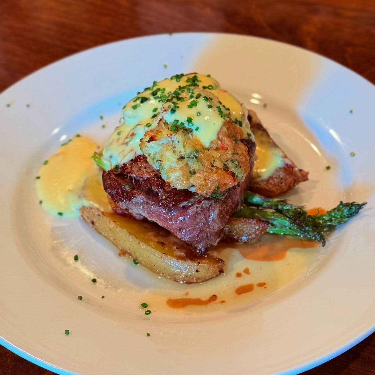 A filet topped with crab and hollandaise