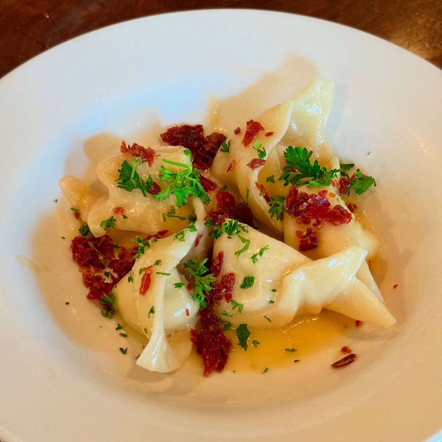 Pasta parcels with sun-dried tomato in a light butter sauce