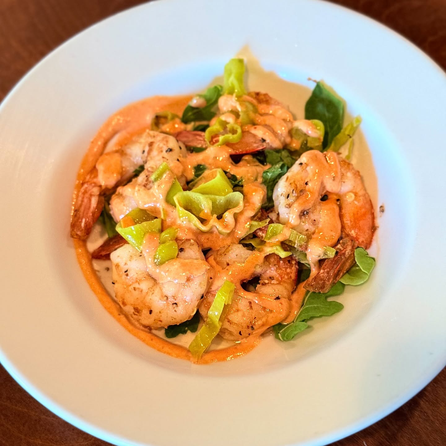 Shrimp in a saffron sauce with ribbons of leek
